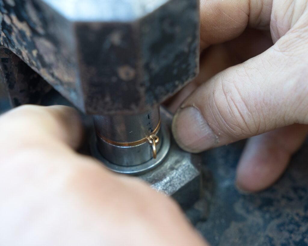 Setting the medallion in drop hammer.